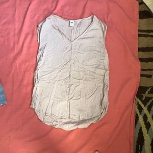 tan sleeveless blouse